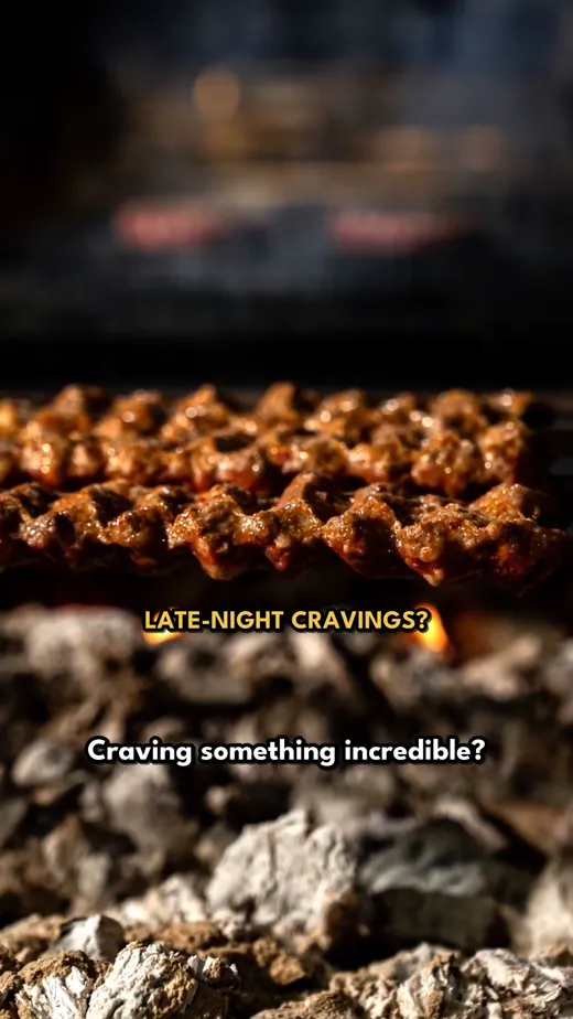 A frame from the finished video: kebabs over charcoal with the caption Craving something incredible?